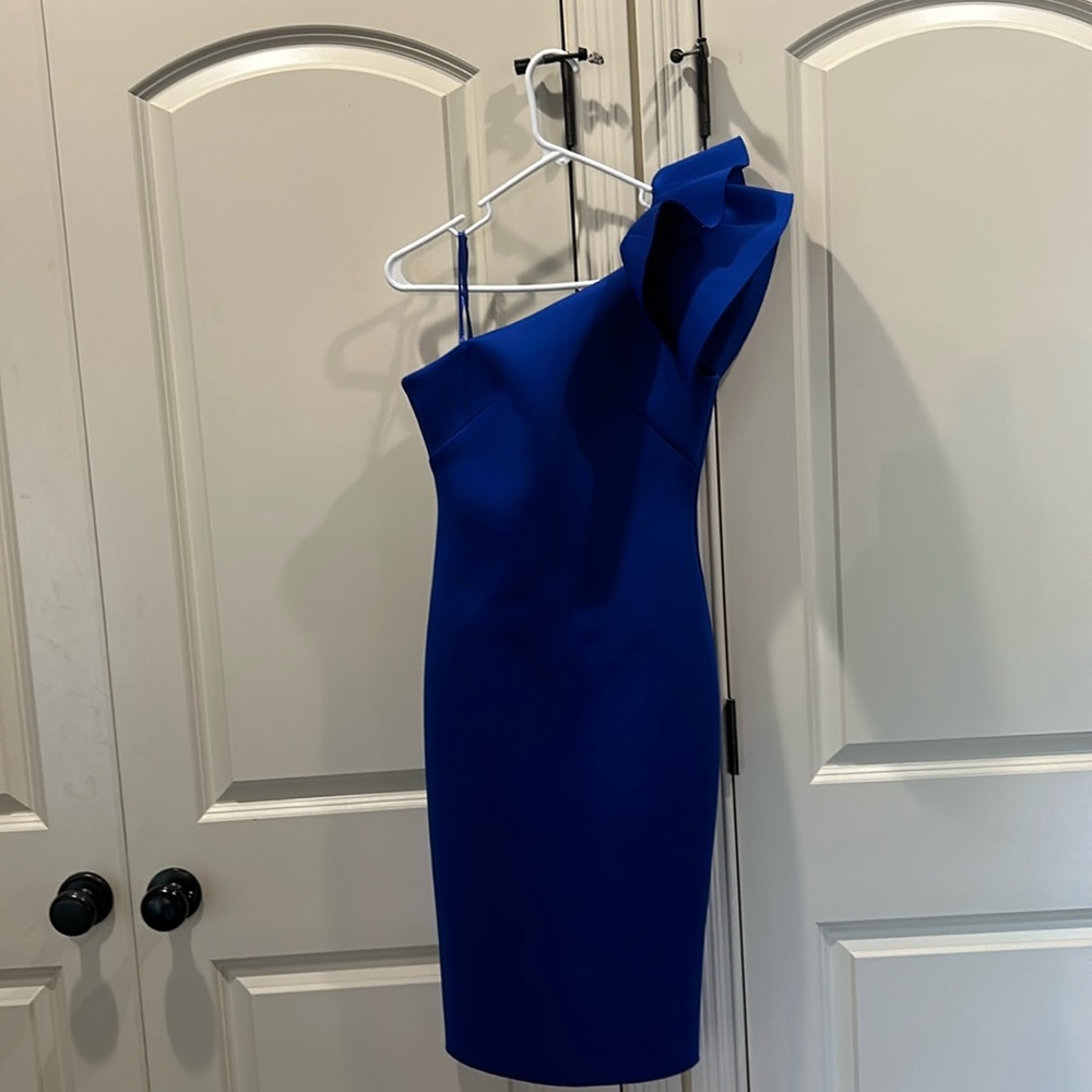 Cocktail dress with sculptural-quality ruffles draping the single shoulder